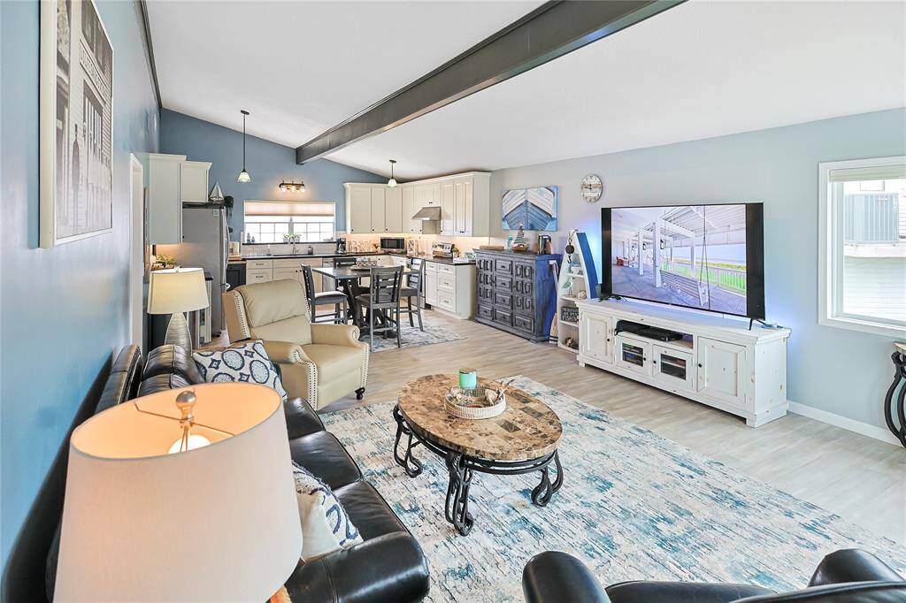 Open-concept living, dining, and kitchen areas offer a seamless layout that’s perfect for gathering, relaxing, and enjoying the waterfront lifestyle.