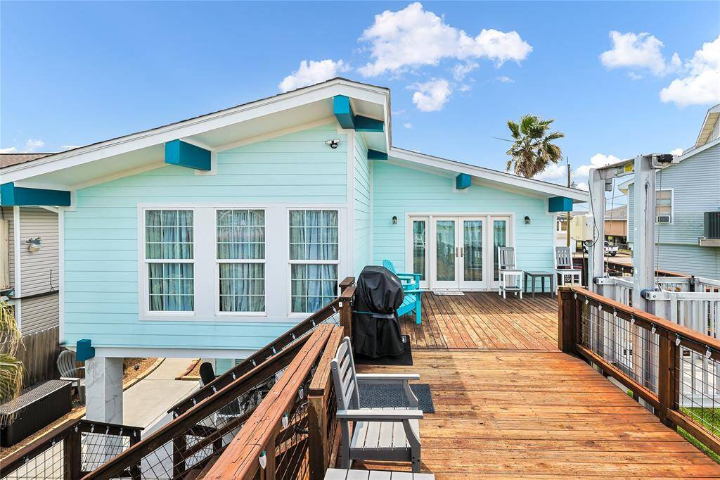 Fresh exterior paint enhances the coastal charm of this home, while the spacious deck offers the perfect spot to relax or entertain with tranquil water views.