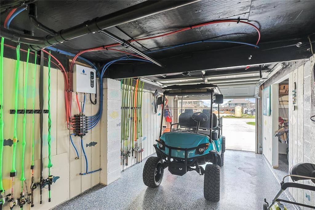 The epoxy ground floor garage also serves as a workshop and storage space. Bring the golf cart and take it out for a cruise of BV!