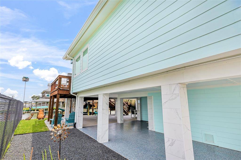 Exterior upgrades include fresh coastal paint, beautifully manicured landscaping, and tiled beams that add to the best part of coastal living: uninterrupted water views that make every moment outdoors feel like a getaway.
