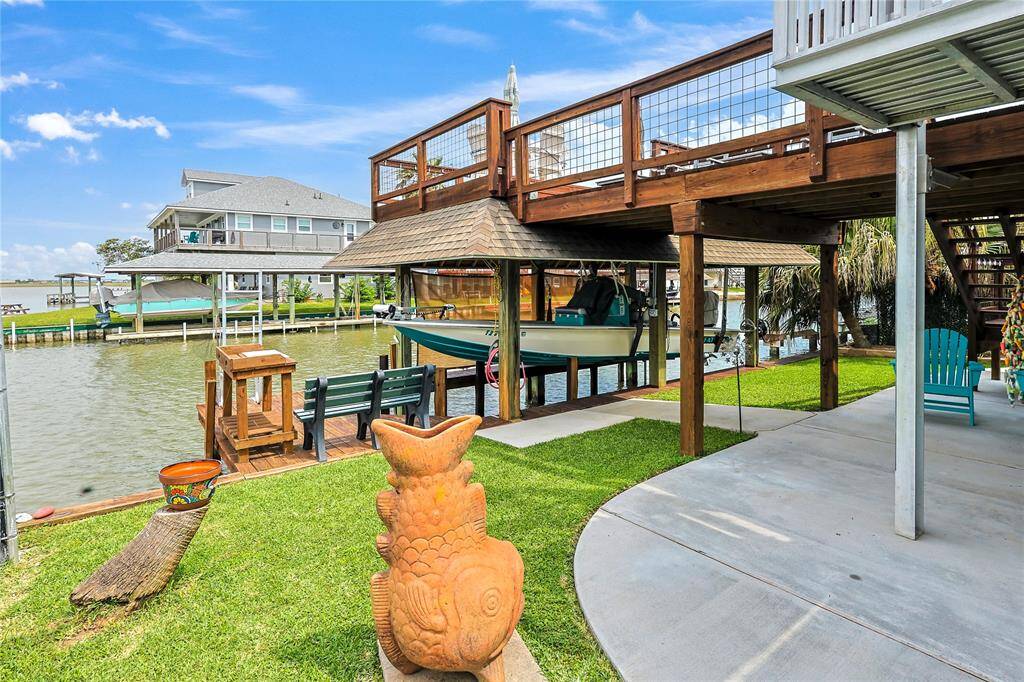 Enjoy the ultimate waterfront lifestyle with a private boat lift, dock, and convenient fish-cleaning station right in your backyard- perfect for boaters and fishing enthusiasts alike.
