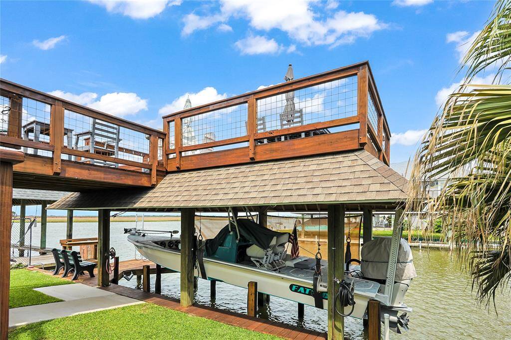 Park your boat just steps from your door with your own private dock and lift- offering unmatched convenience and the joy of waterfront living right in your backyard.