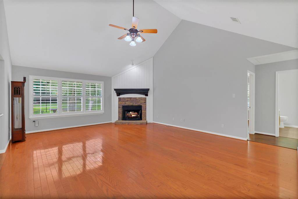 Living room with cozy corner fireplace