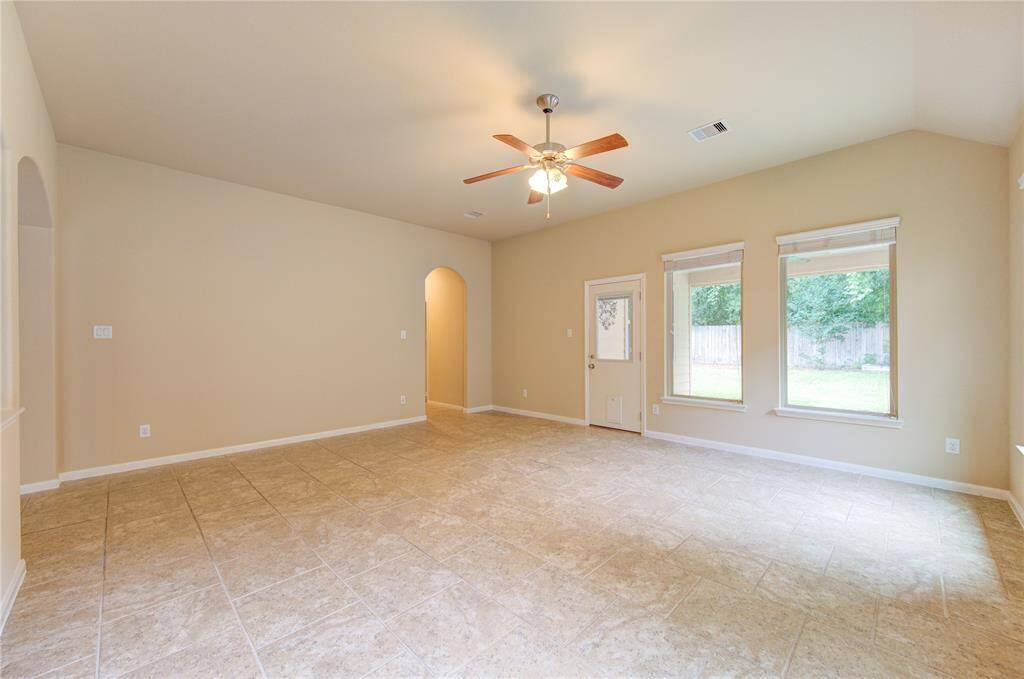 Living room facing back patio and yard