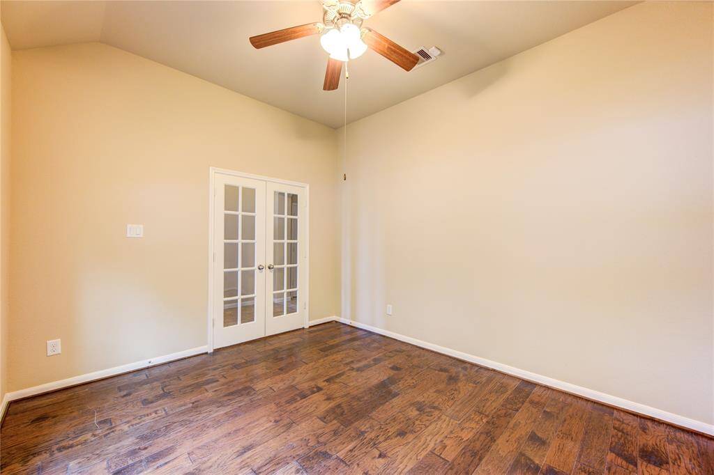 Study with french doors and wood floors