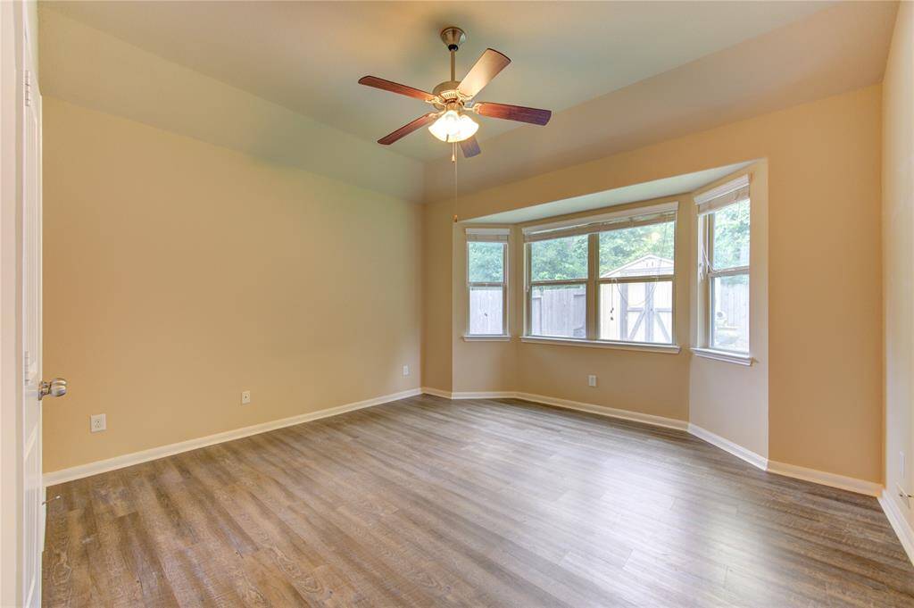 Primary bedroom facing backyard