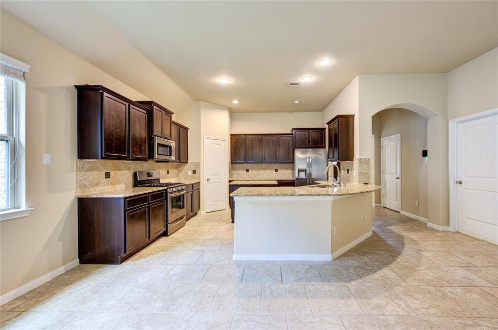 Dining room facing breakfast bar and kitchen