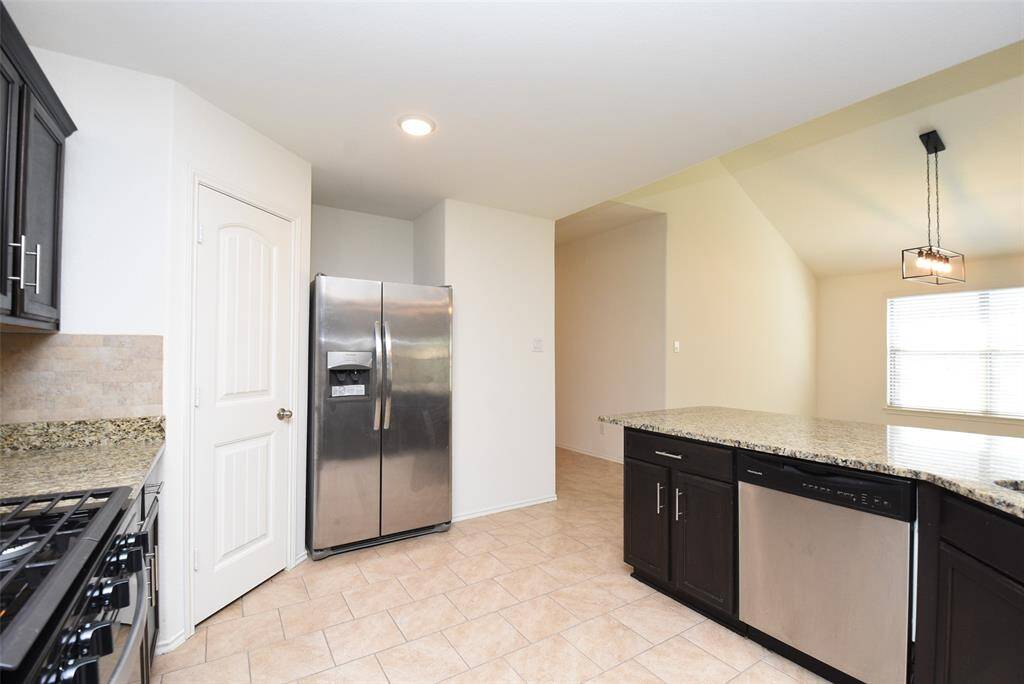 Kitchen is conveniently located next to the dining room.