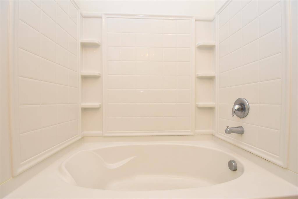Wonderful soaker tub w/ tons of storage in primary bath.