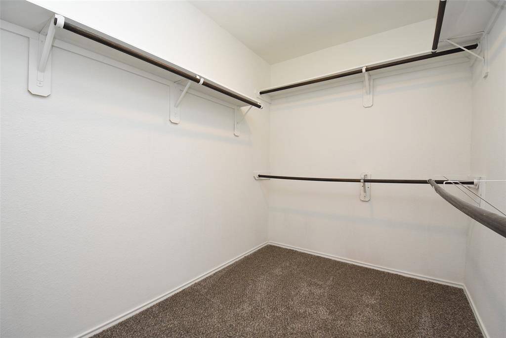 Large walk-in closet in primary bedroom.