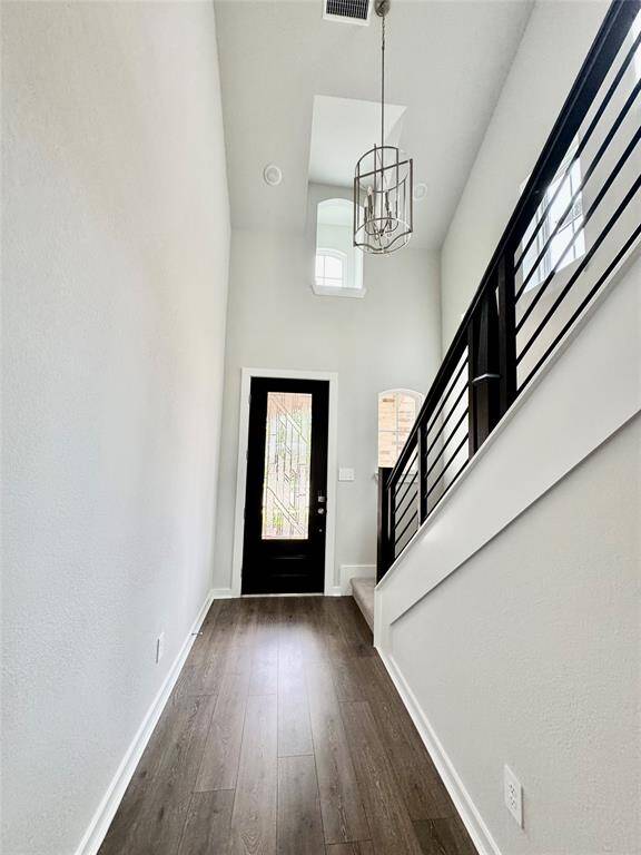 High ceiling entrance with ample lighting.