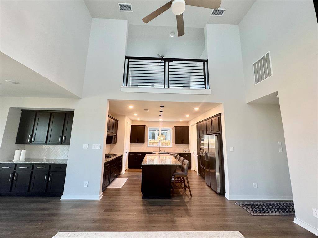 The upgraded kitchen opens to the living room.
