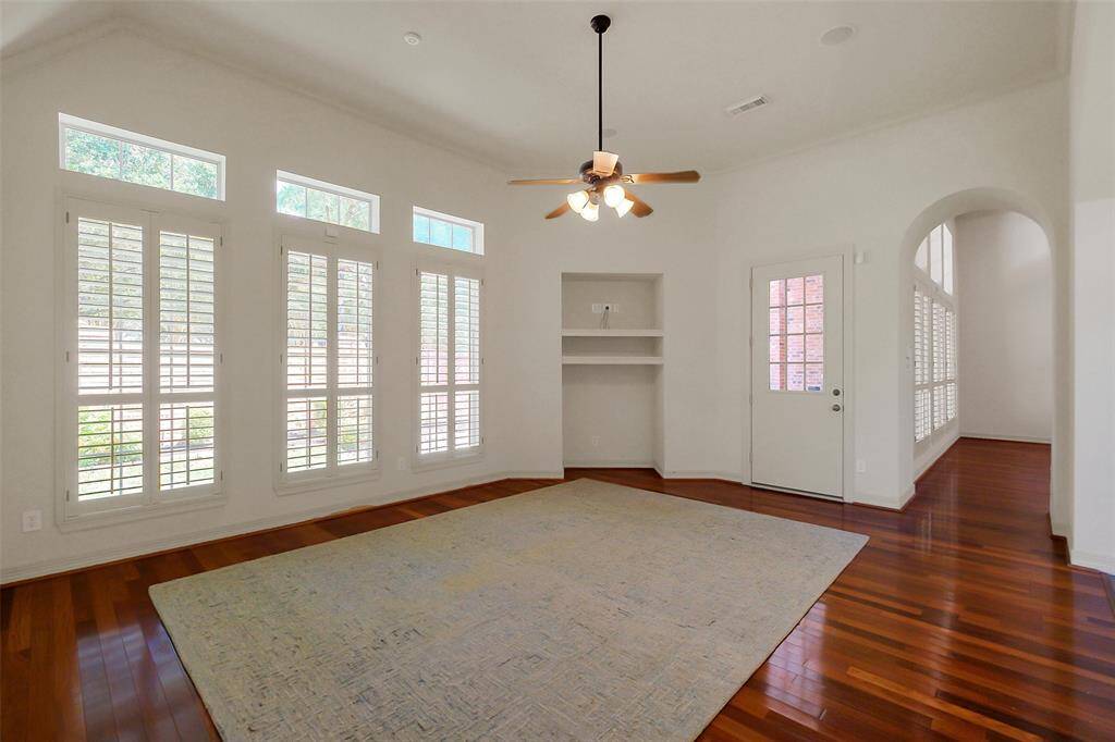 High ceilings and a wall of windows make this a lovley spot for the family to gather