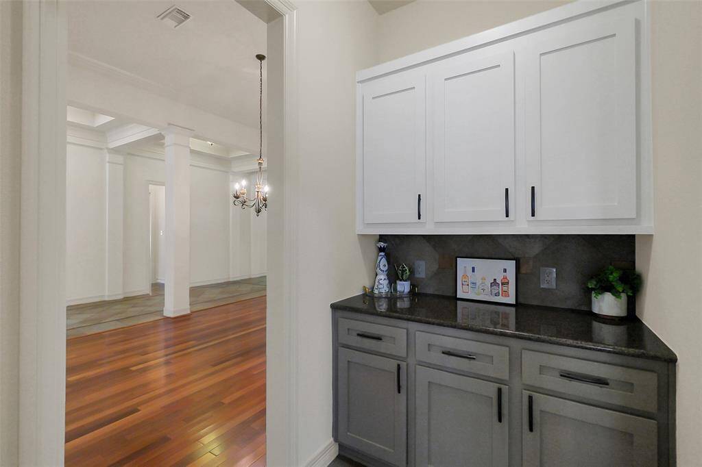 A convenient butlers pantry connects the kitchen and formal dining room.