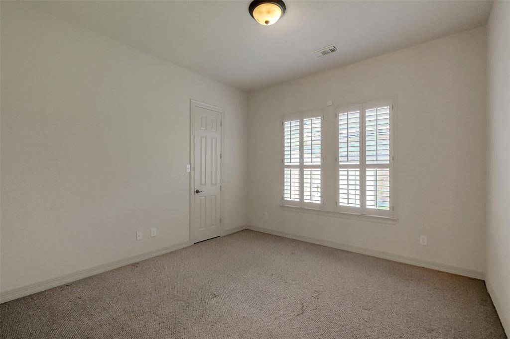 One of three secondary bedrooms.