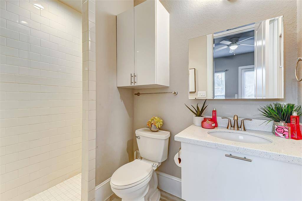 The bathroom features a spacious shower. It adds convenience and comfort to your daily routine.