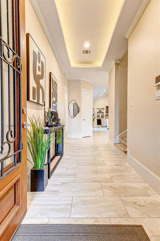 As you step inside, you'll be greeted by an inviting foyer that leads you into the heart of the home. The open- concept layout seamlessly connects the living room, dining area, and kitchen, creating an ideal space for entertaining and everyday living.