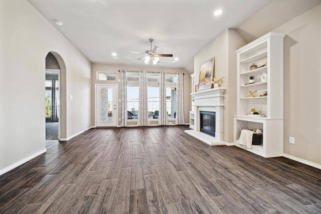 Additional canned lighting has been installed and the living area is wired for surround sound to enhance the open concept living space.