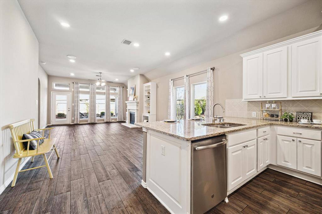 Kitchen and living are a seamless transition. Living and entertaining here will be a joy. The elegance of this home is in its simplicity and the well chosen finishes that effortlessly blend together.