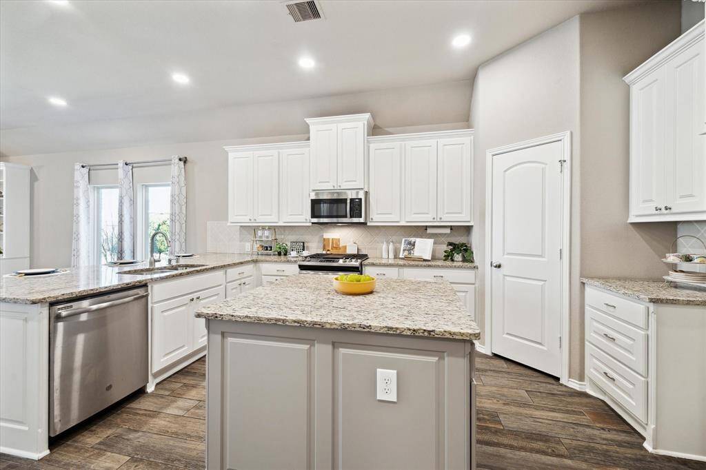 This chef's kitchen has room for everyone and counterspace a plenty.