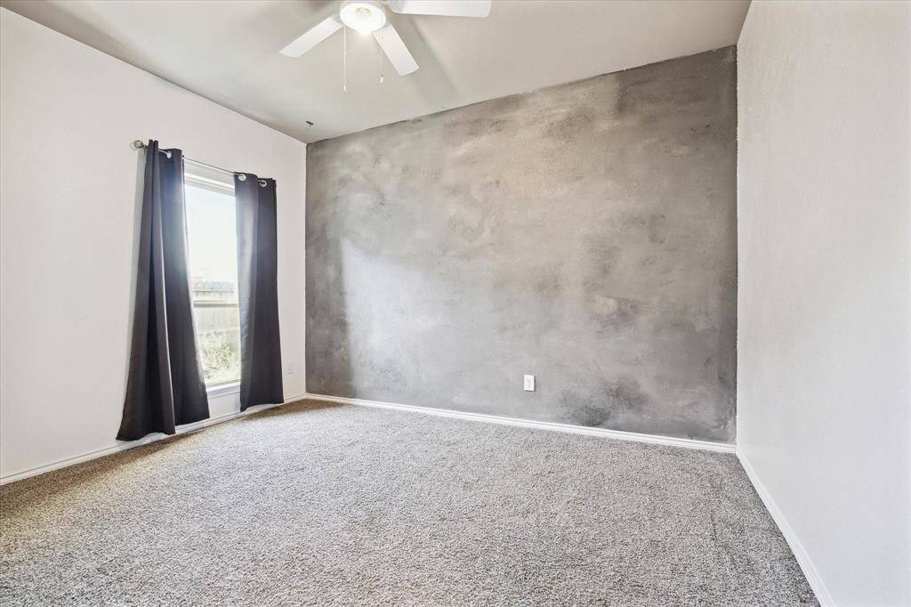 All three secondary bedrooms have ceiling fans and are carpeted.