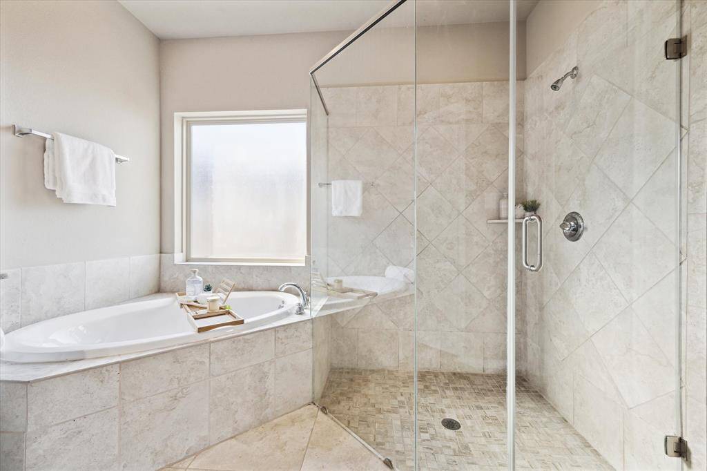 Primary bath has a luxurious soaking tub and massive walk in shower.