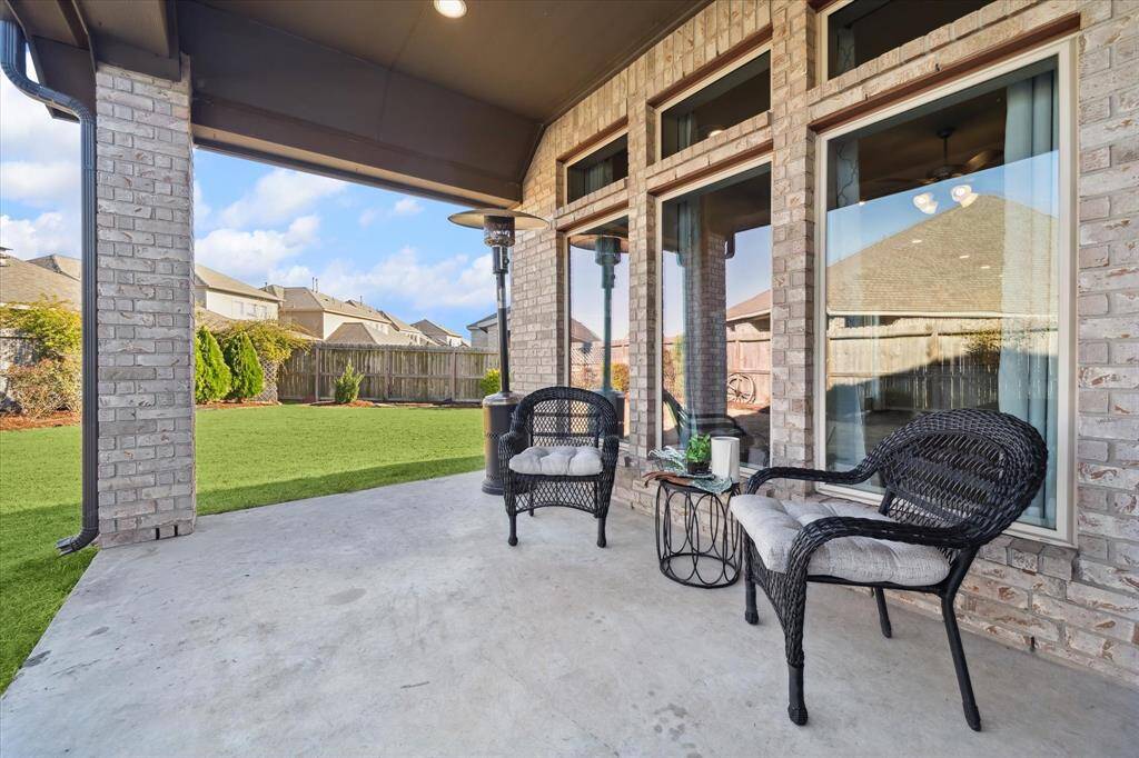 The best seat in the house. Your covered patio is where you can take in the beautiful landscaped gardens, bird song from your Purple Martin house, and visitors to your butterfly garden.