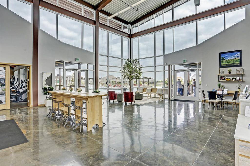 The Harvest Green Farmhouse features a large, rentable event space for resident use. The main area features access to pool, studio and fitness center.