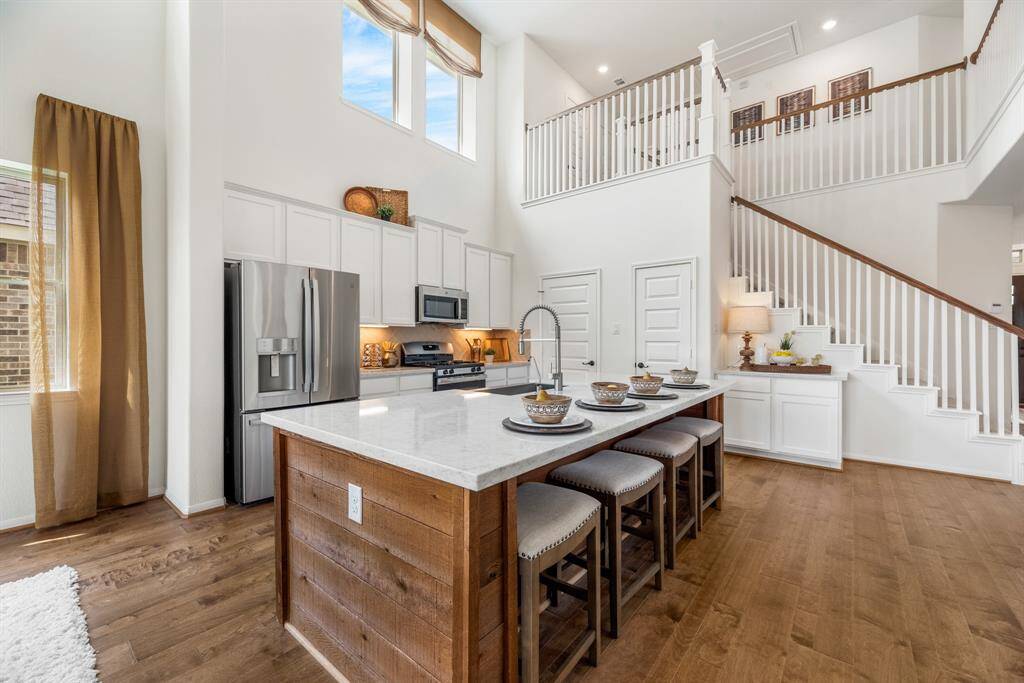 Island kitchen with quartz countertops (*Photo not of actual home and used for illustration purposes only.)