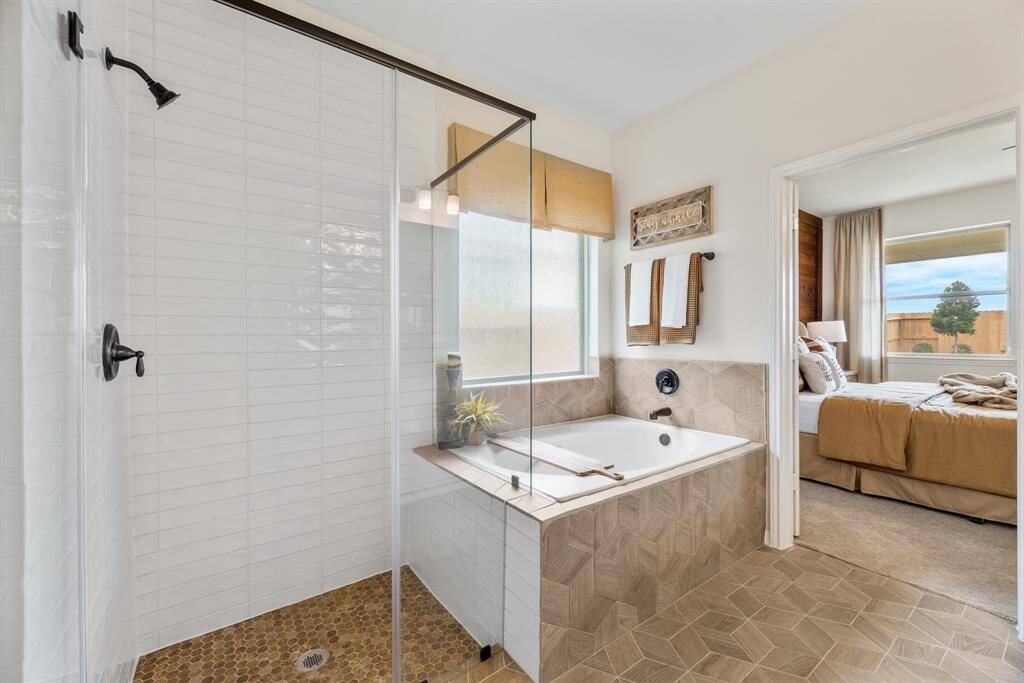 Soaker tub and separate shower in owner's bath (*Photo not of actual home and used for illustration purposes only.)