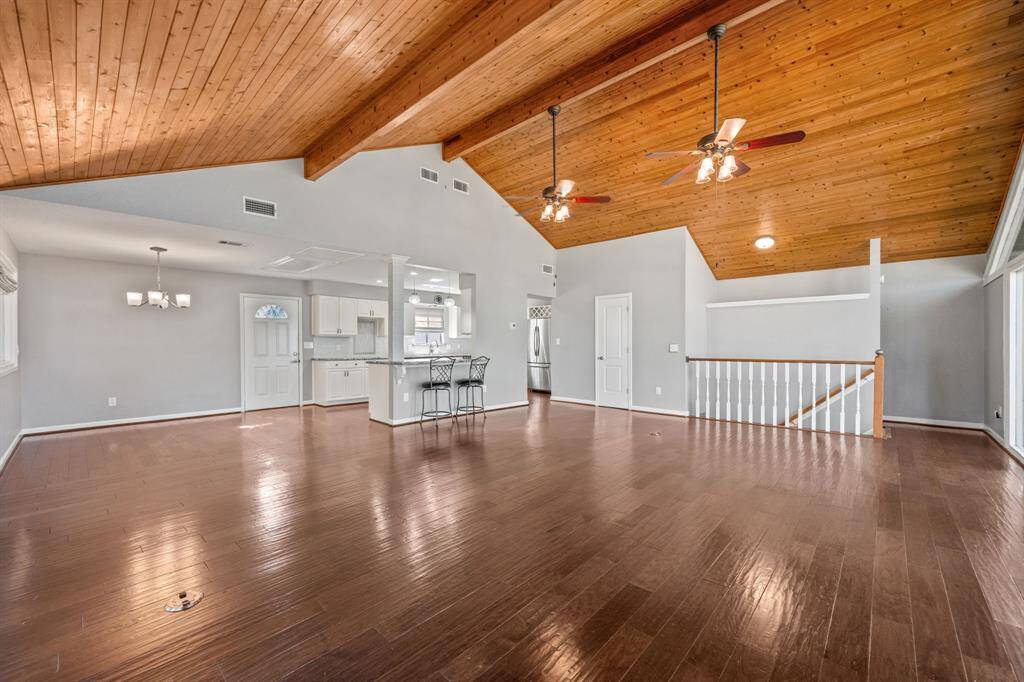 Living area is open to the kitchen and dining. Door to right of kitchen is half bath.