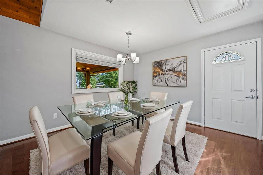 Virtually staged dining room on main floor.