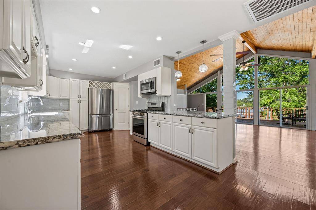 Beautifully updated kitchen with stainless appliances, corner pantry and plenty of cabinet and counter space. Refrigerator remains.