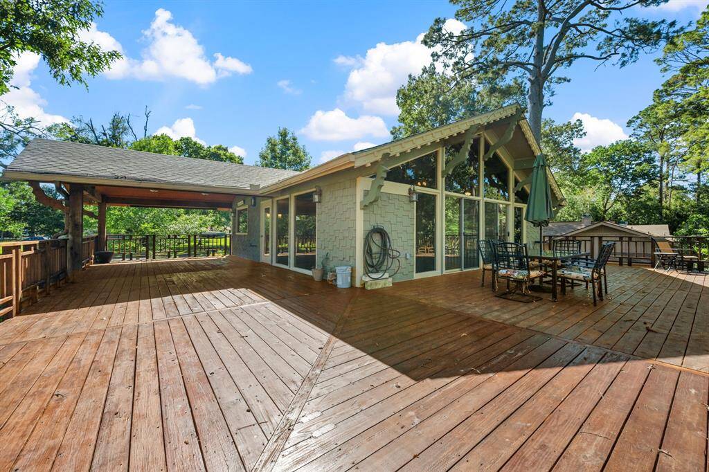 Exterior of home from corner of L shaped deck. Deck is approximately 1200 sq ft.