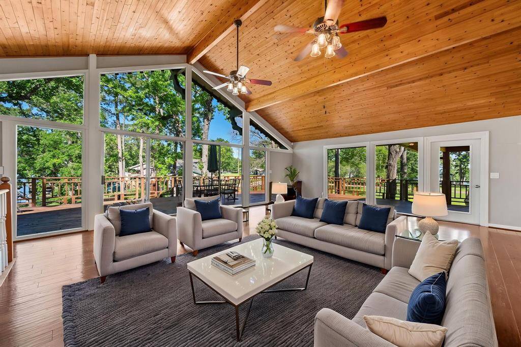 Virtually staged living area on the main floor. Check out that wall of glass offering stunning water views!