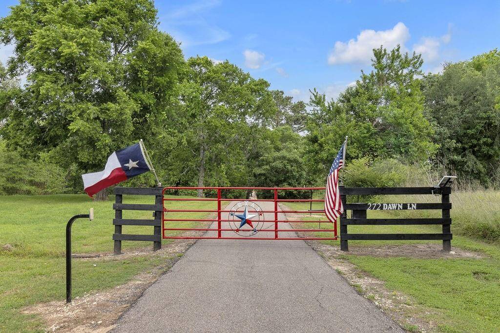 Gated Entry and a long paved driveway