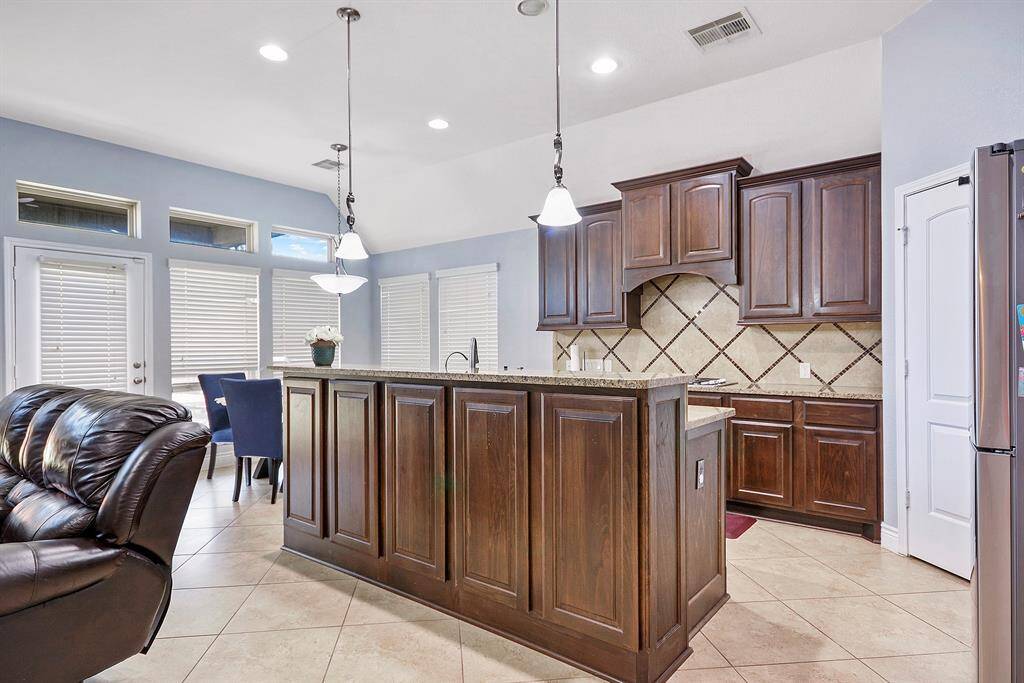 The functionality of this kitchen is perfect. Great layout. Ton of cabinetry and storage space. Island has storage area on all 4 sides.