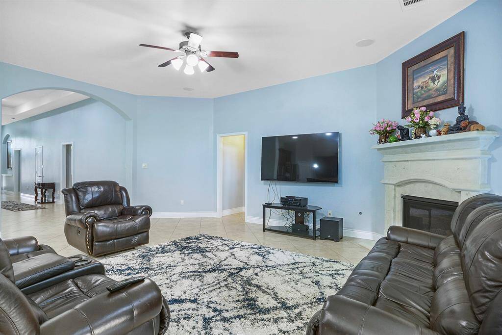 Open living concept living room. View to your front door.Great living room space and with a stone cast gas fireplace.