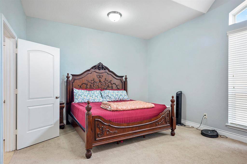 Your Primary bedroom retreat, features a private entrance off the living room hall, large windows that face the back yard, and tons of space for all your large bedroom furniture.