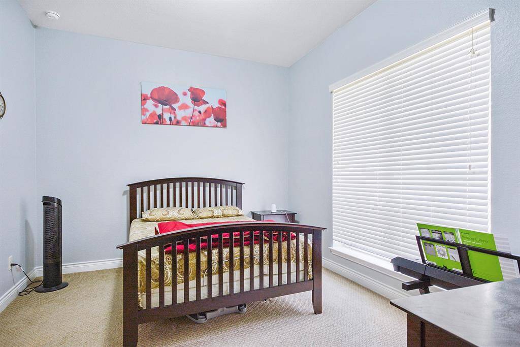 1 of 4 bedrooms Has a walk-in closet and nice window with treatment.