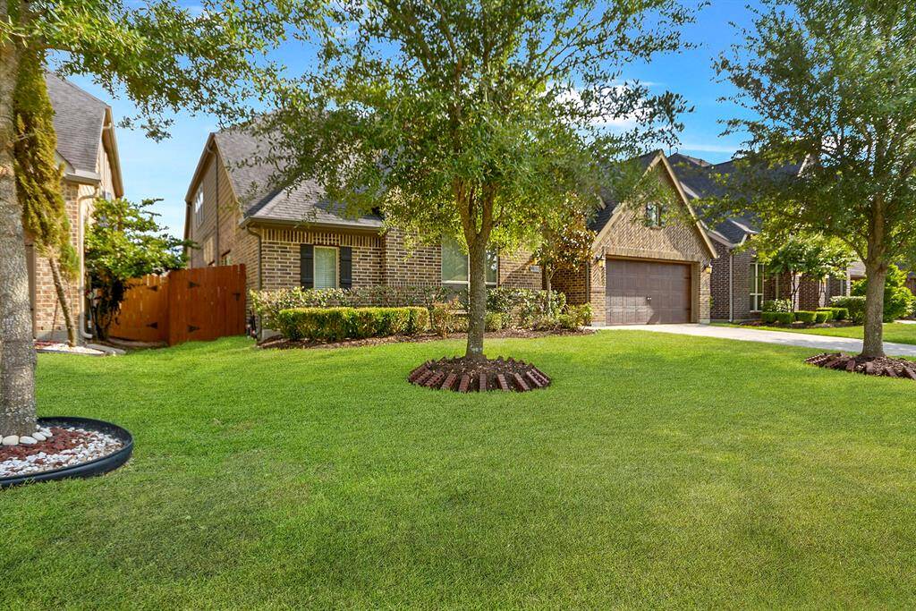 Beautiful curb appeal with manicured landscaping.