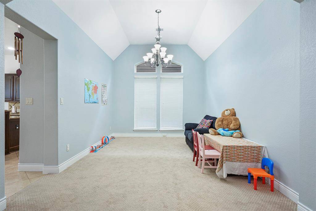 Formal Dining room leading to the Kitchen. Wide entrance, with incredible views of the floor to ceiling windows. Welcome Home!