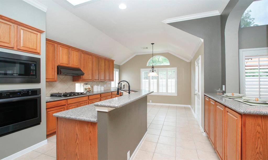 Cooking while entertaining guests is easily accomplished in this open and versatile kitchen! View overlooking the breakfast area.