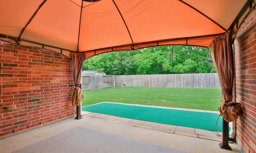 Step outside to a wonderful backyard space with canopy covered patio, green velvet landscape and NO BACK NEIGHBORS!