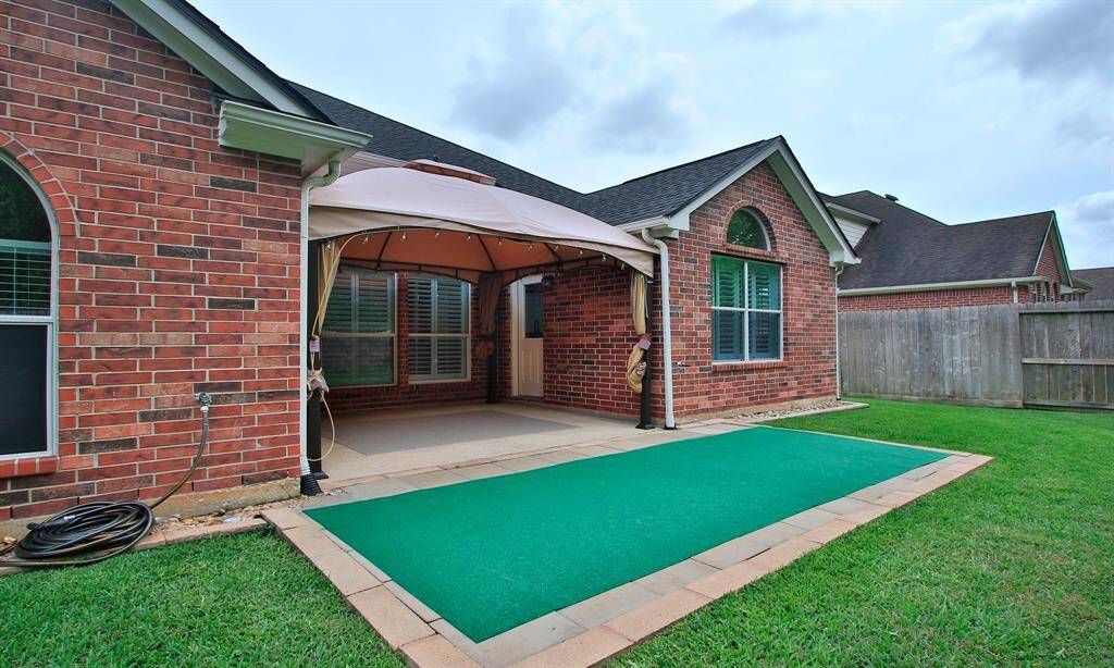 This backyard patio is ideal for those weekend family barbecues or simply relaxing after a long day.