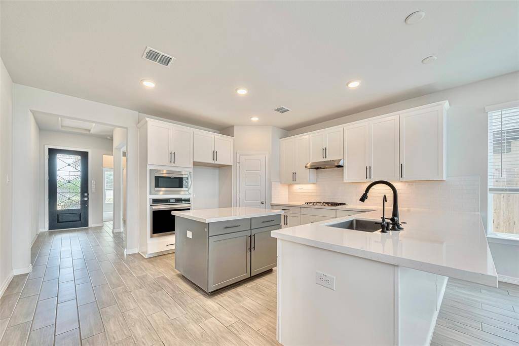 Bright, open space with light-painted walls and modern tile flooring.