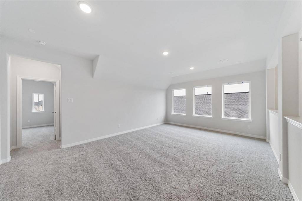 Huge 20 x 14 game room upstairs perfect for entertainment and relaxation.