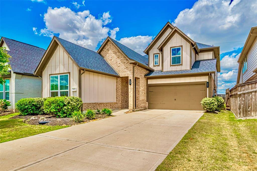 Discover this stunning modern two-story home, featuring a stylish look. The sleek exterior and expansive driveway offer a perfect blend of elegance and functionality.