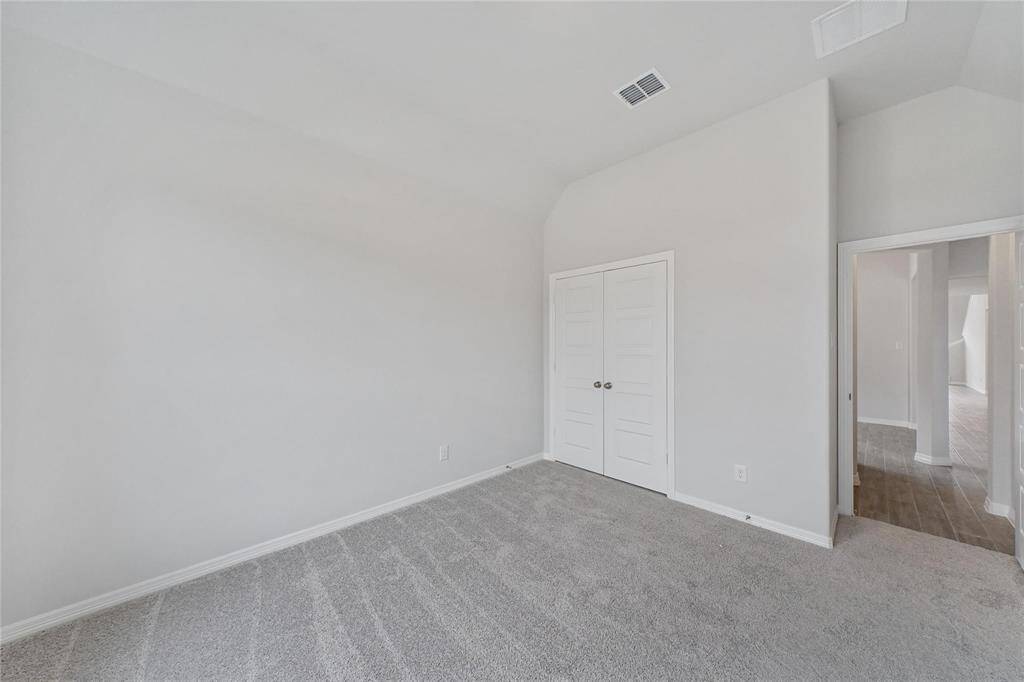Guest bedroom (2nd downstairs) featuring a double-door closet and a full bathroom. Ideal as a guest bedroom or home office.