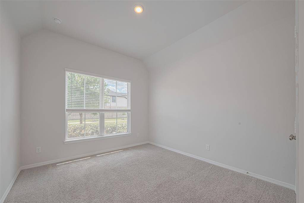 Guest bedroom (2nd downstairs) featuring a double-door closet and a full bathroom. Ideal as a guest bedroom or home office.
